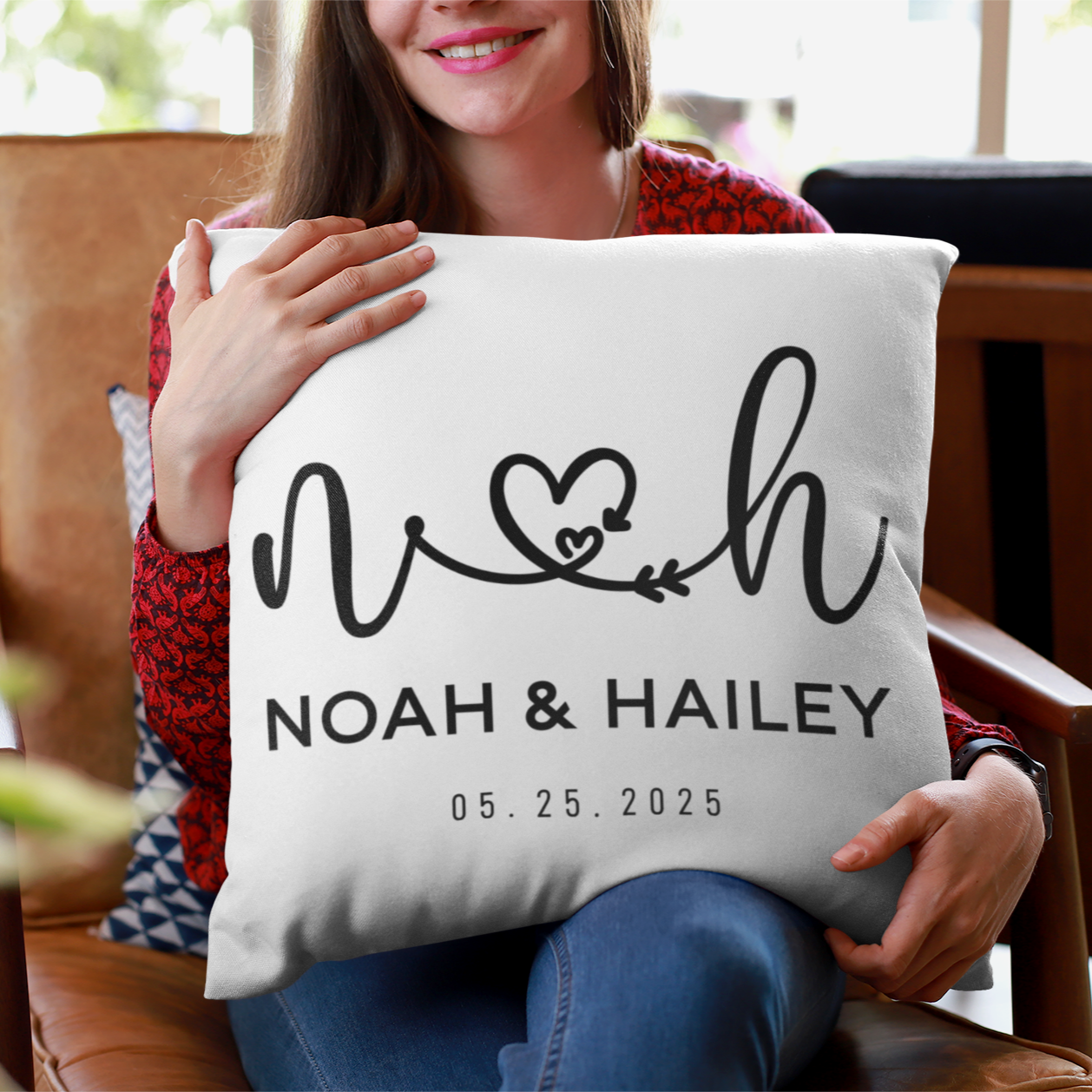 Cutom pillow with couple name 'NOAH & HAILEY' text and design.
