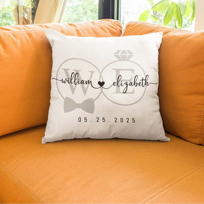 White pillow with personalized design on an orange couch